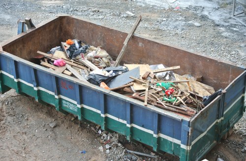 Construction site with builders handling waste